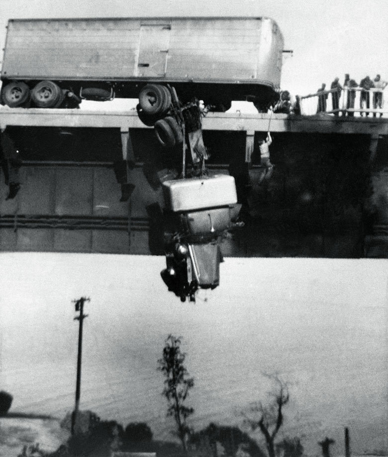 hauntedbystorytelling:“ Virginia SCHAU :: Paul Overby, one of two drivers trapped in the cab of a truck, is pulled to safety by a rope on the Pit River Bridge, over Shasta Lake, CA, 3 May 1953 [Pulitzer Prize]”