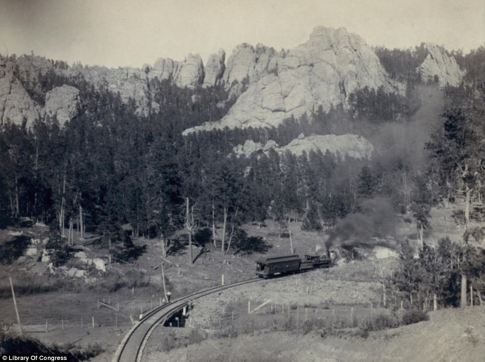 As the railroads went further west, so the settlers followed. Grabill's image Horse Shoe Curve in the shadow of the Buckhorn Mountains