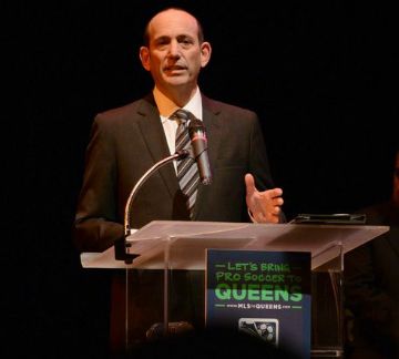 MLS commissioner Don Garber addresses the crowd at the Queens Theatre on Tuesday night.
