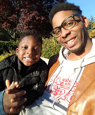 A.D. Largie, founder of Kemet Kids Publishing, with his 4-year old son
