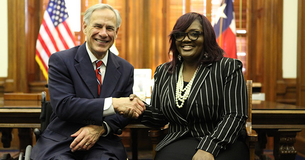 Tamala Austin, founder of J.I.V.E. Juice with the governor of Texas