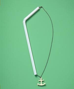 Thread your necklace through a plastic drinking straw to keep the chain from tangling