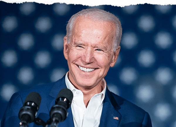 Smiling President Biden giving a speech