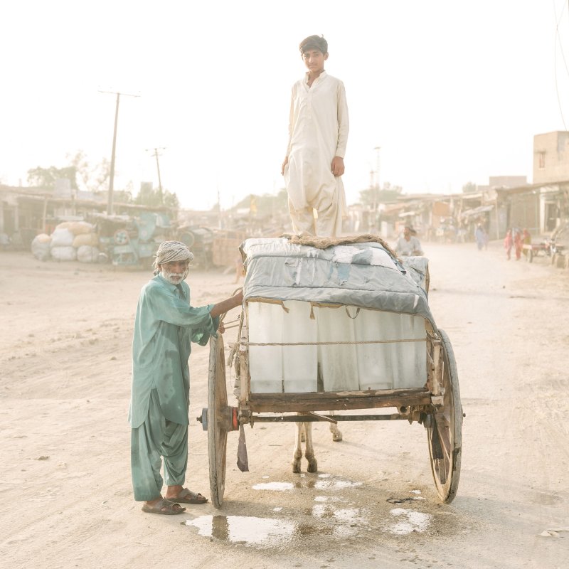 Ice sellers in Pakistan.  The Hottest City on Earth,  Sept. 23 issue.