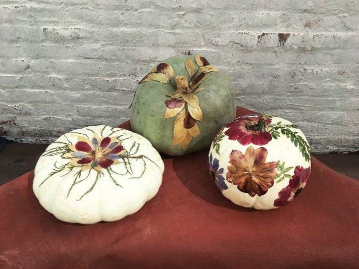 s 13 popular ways to decorate a pumpkin with little or no carving, Glue on some pressed leaves and flowers