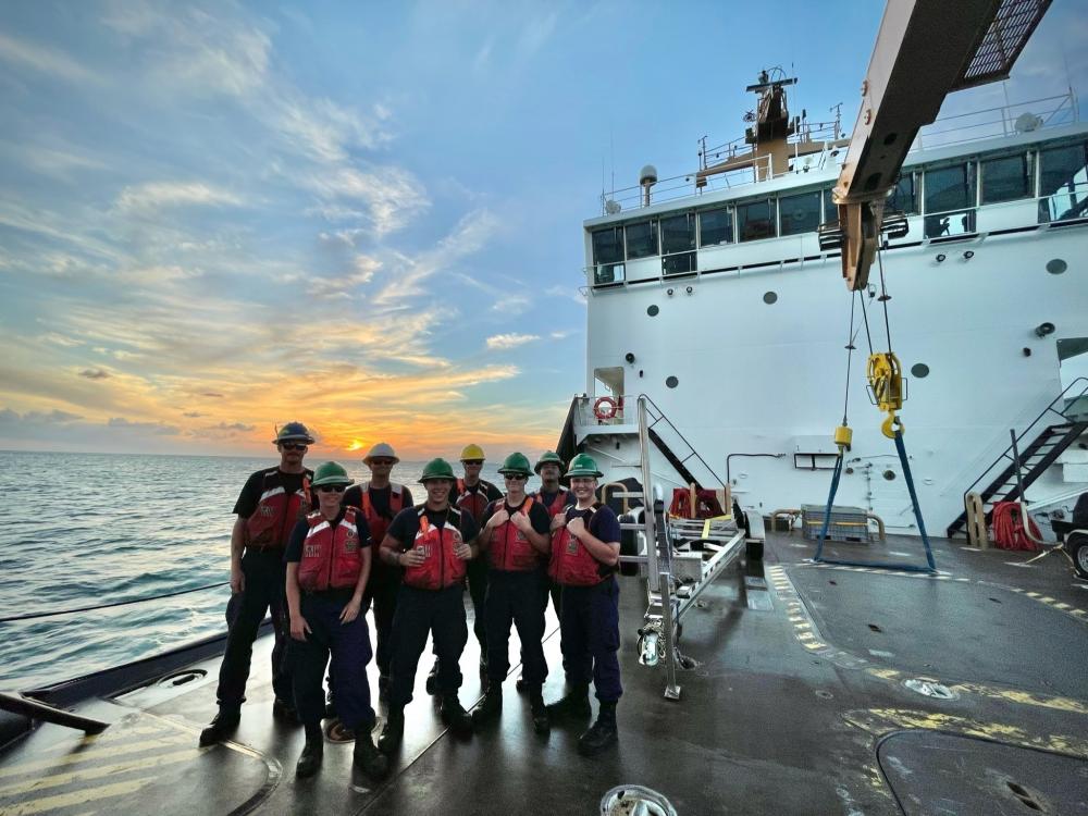 The Coast Guard Cutter Cypress deck department stands on the buoy deck while the vessel transits from Los Angeles, California, to the ship's new homeport in Kodiak, Alaska, Oct. 19, 2021. The Cypress will be filling the role of the “Aleutian Keeper,” replacing the Coast Guard Cutter SPAR as the 225-foot Juniper Class Buoy Tender and will be responsible for servicing aids throughout Kodiak Island and the Aleutian chain. U.S. Coast Guard photo by Petty Officer 1st Class Amanda Harris.