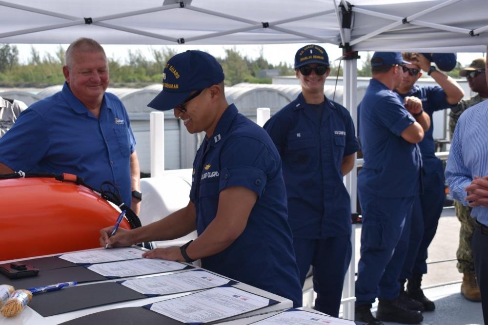 Coast Guard Lt. Paul Kang, commanding officer of Cutter Douglas Denman, accepts delivery of the 49th Fast Response Cutter Douglas Denman, in Key West, Florida, May 26, 2022. The cutter will be homeported in Ketchikan, Alaska. (U.S. Coast Guard photo)