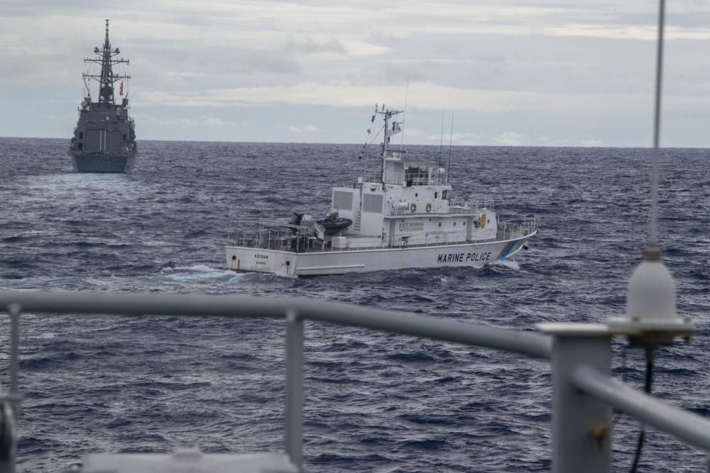 Japan Self-Defense Force (JMSDF) ship JS Kirisame (DD 104), front left, Palau Patrol Ship PPS Kedam, center, and Royal Navy River Class vessel HMS Tamar (P233) transit the Pacific Ocean during a multilateral search and rescue exercise (SAREX)
