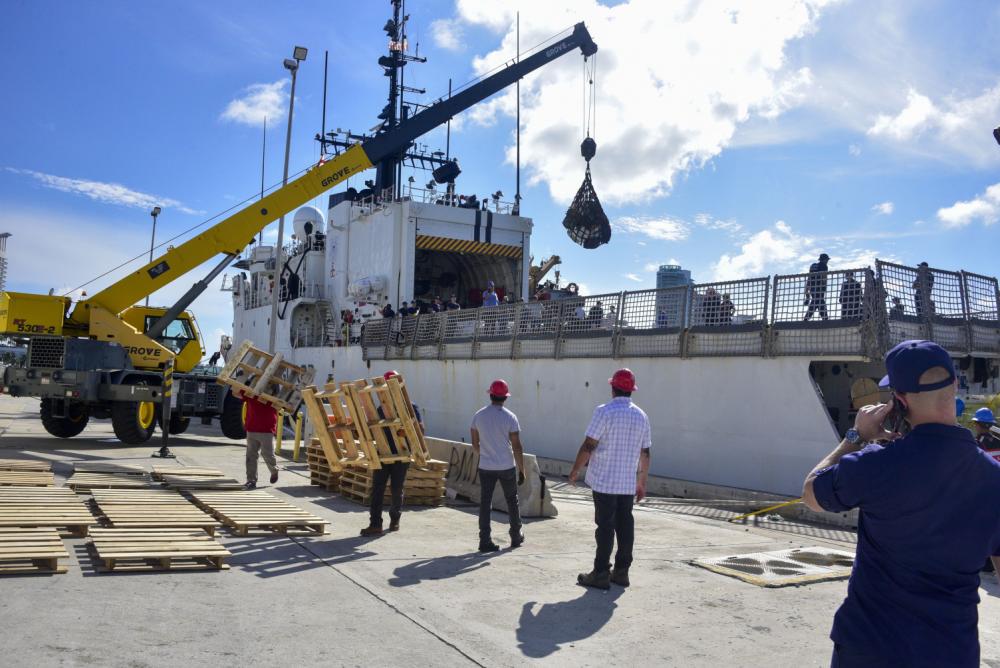 Suspected narcotics are removed via crane from USCGC Legare in Miami, Florida