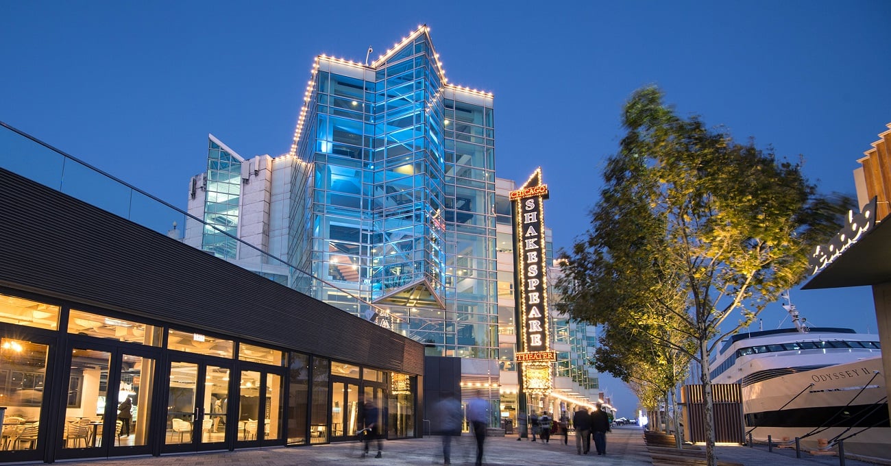 The exterior of Chicago Shakespeare Theater lit up on Navy Pier at night