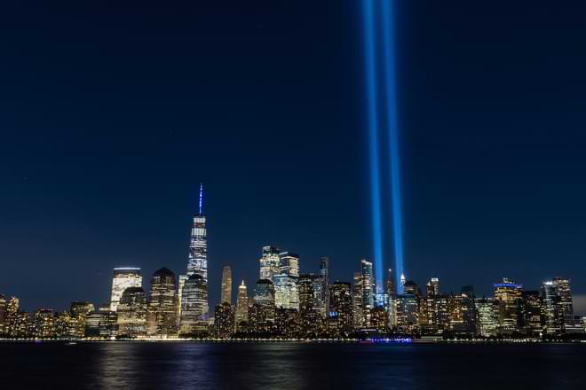 Tribute in Light, two vertical columns of light representing the fallen towers of the World Trade Center shine against the lower Manhattan skyline on the 19th anniversary of the September 11, 2001 terror attacks, seen from Jersey City, N.J., Friday, Sept. 11, 2020. (AP Photo/Stefan Jeremiah)
