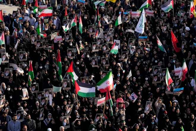 Iranian protestors attend an anti-Israel rally as they hold up posters of the Supreme Leader Ayatollah Ali Khamenei and Iranian and Palestinian flags, at Enqelab-e-Eslami (Islamic Revolution) Square in Tehran, Iran, Wednesday, Oct. 18, 2023. (AP Photo/Vahid Salemi)