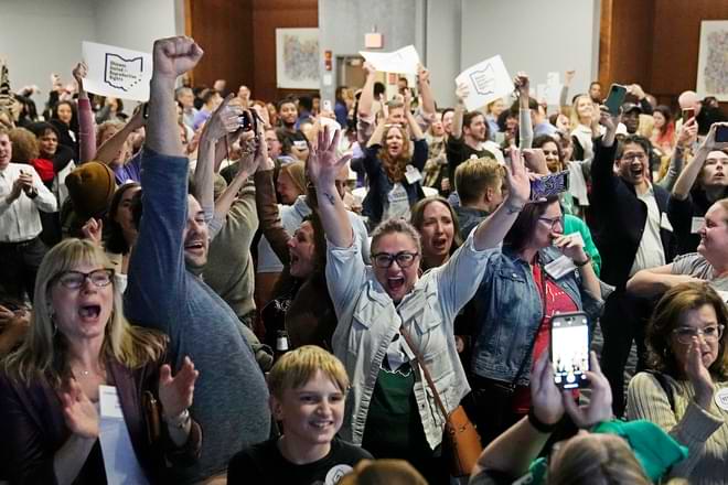 Issue 1 supporters cheer as they watch election results come in, Tuesday, Nov. 7, 2023, in Columbus Ohio. Ohio voters have approved a constitutional amendment that guarantees the right to abortion and other forms of reproductive health care. (AP Photo/Sue Ogrocki)