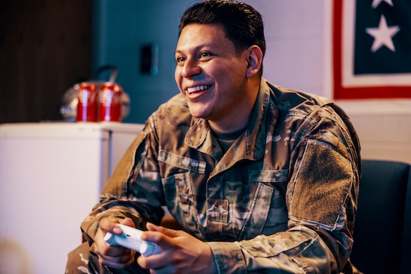 Service members playing video games and card games at USO Centers. Service members playing video games and card games at USO Centers.