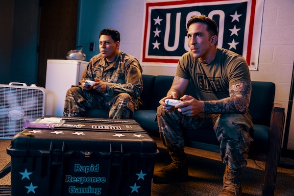 Service members playing video games and card games at USO Centers. Service members playing video games and card games at USO Centers.