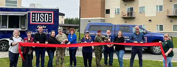 USO Volunteers at a ribbon cutting ceremony for the USO mobile center USO Volunteers at a ribbon cutting ceremony for the USO mobile center