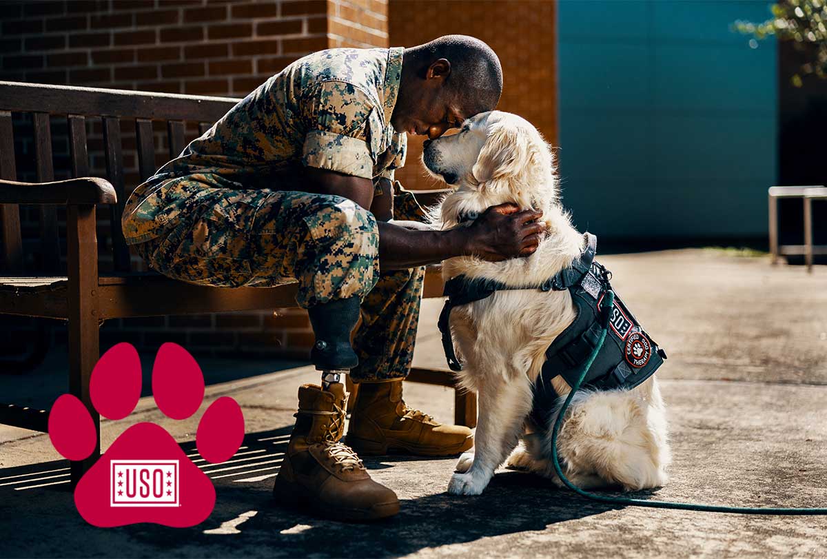 Service member with USO Canine Service member with USO Canine