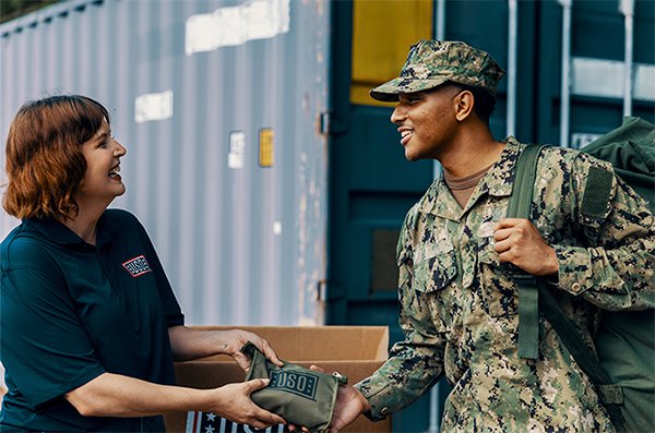 Service member receives USO aid. Service member receives USO aid.