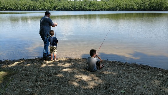 Father and sons fishing
