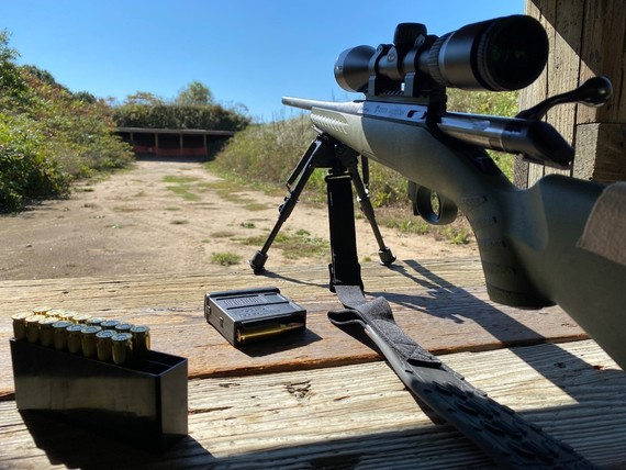 Rifle aimed at target at a shooting range