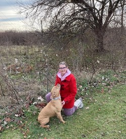 Woman poses with her dog