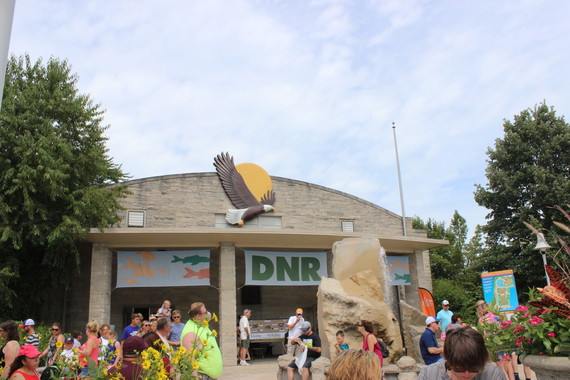 A crowd dispersed in front of the DNR Building at the State Fair.