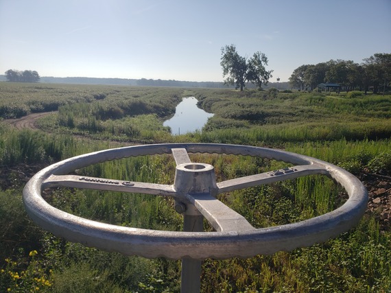 J.C. Murphey Lake dam closure, with a ditch being filled with water in the background.