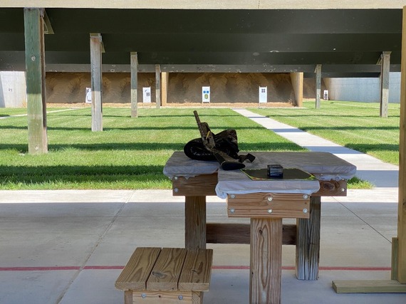 A gun resting on a table at a DNR shooting range.