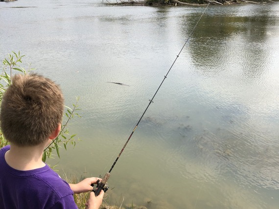 A child fishing.