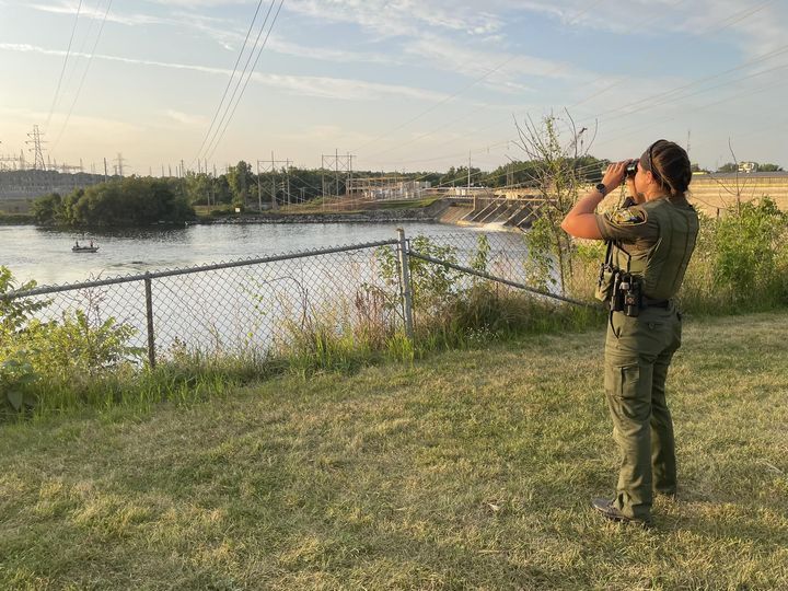 A conservation officer patrols wetlands.