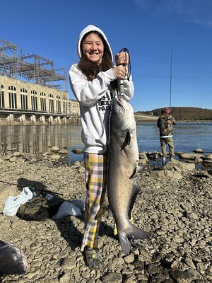 Photo of girl holding a large fish near Conowingo Dam