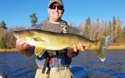 angler holding a large walleye