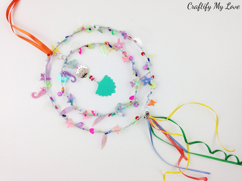 learn how to make a beaded suncatcher DIY to make your garden more colorful