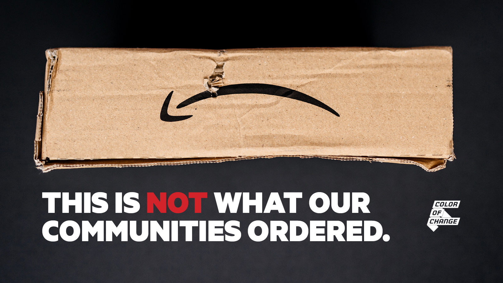 An image of a damaged package with the Amazon logo upside down so it looks like a frown. The text reads "This is not what our communities ordered." The Color Of Change logo is in the top right.