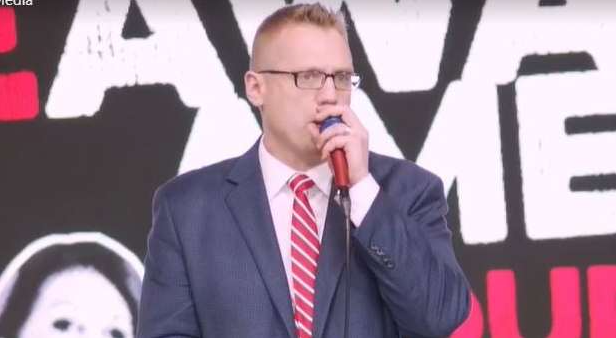 Image of Clay Clark speaking at the REAWAKEN America tour