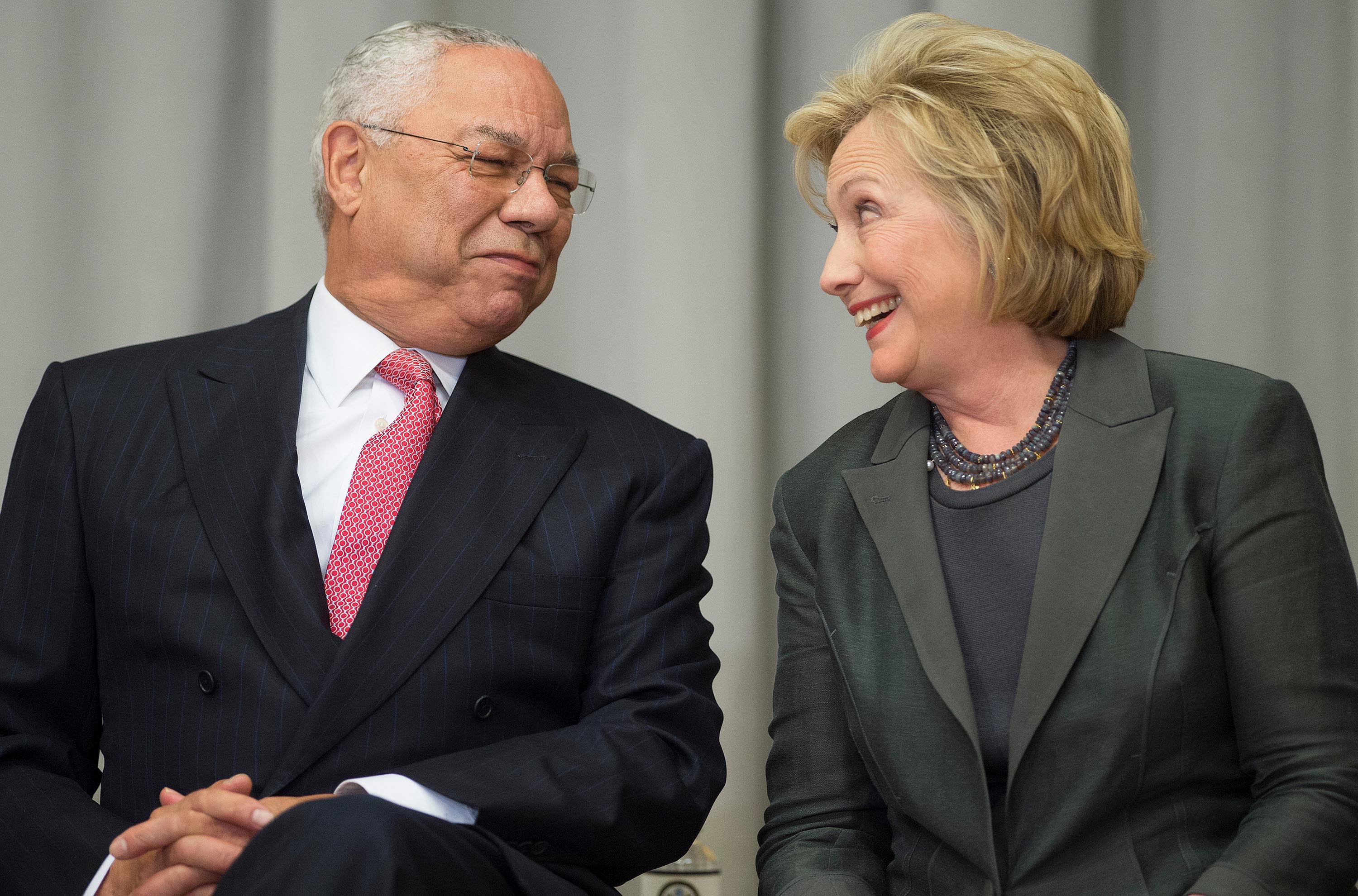 Former US Secretaries of State Colin Powell and Hillary Clinton speak during a ceremony to break ground on the US Diplomacy Center at the US State Department in Washington, DC, September 3, 2014.