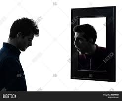 Image result for picture of man standing in front of a mirror
