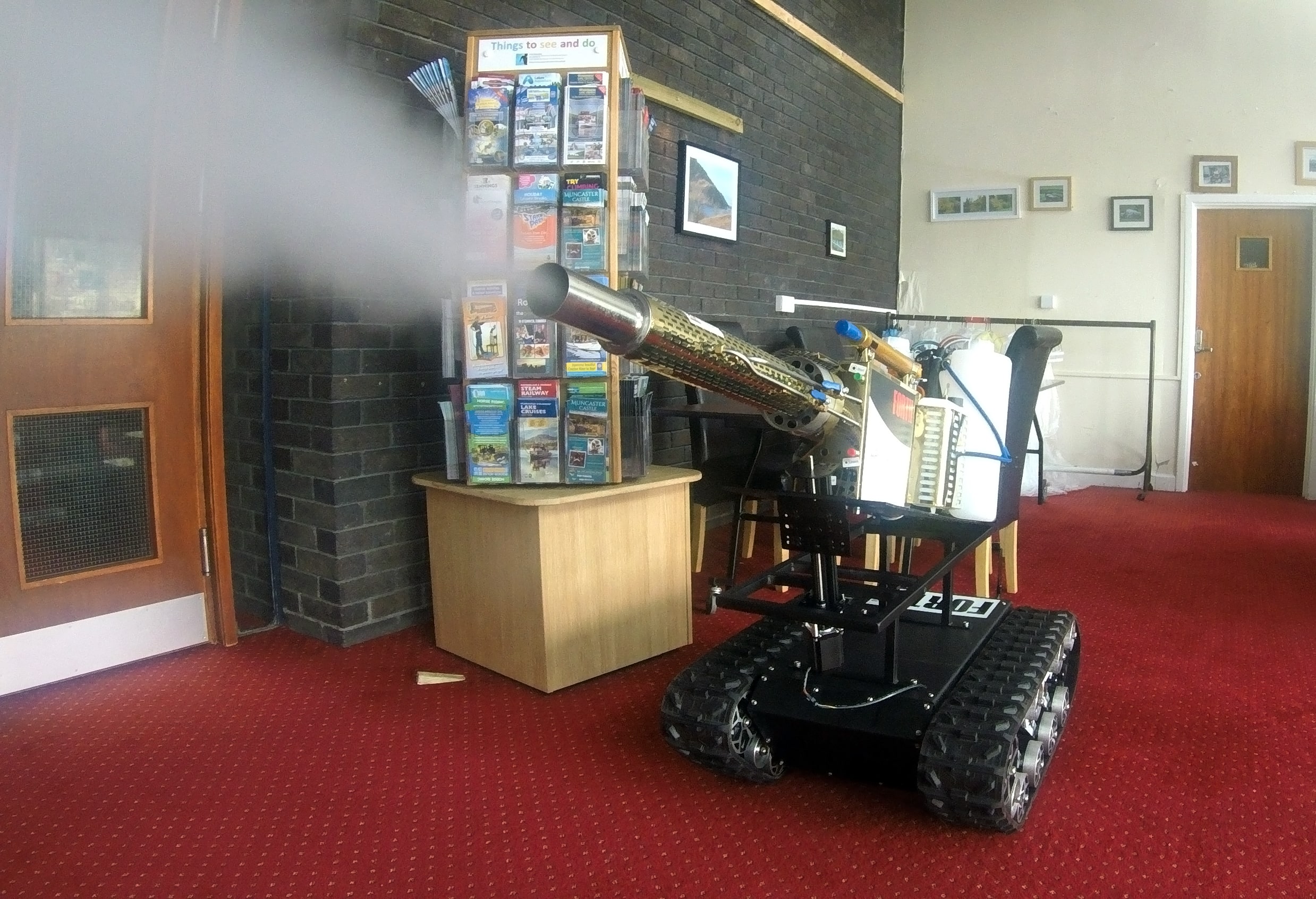 Forth's disinfecting robot being demonstrated in a reception area at Whitehaven Civic Hall-min (1).jpg