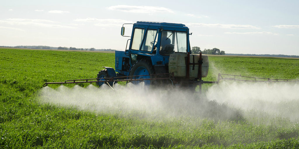 Tractor spraying herbicide (cc photo: Aqua Mechanical)