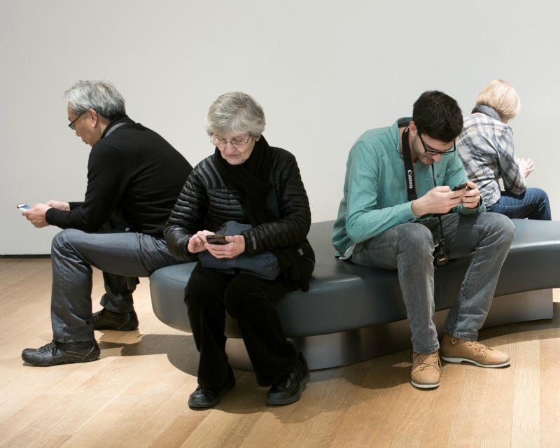 Cell phone users (cc photo: Susan Sermoneta)