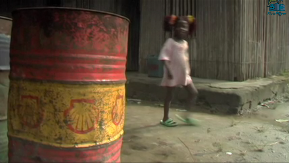 Girl with Shell oil barrel