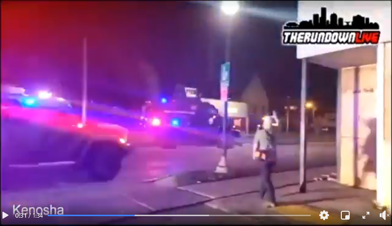 Kenosha police in military vehicles greet Kyle Rittenhouse