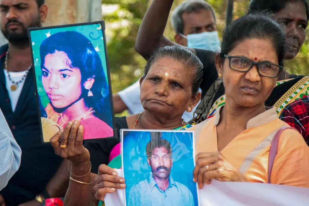 Tamil women hold portraits of their missing relatives during a protest demanding justice for the missed ones near the Chemmani mass graves in the former war zone of Jaffna on July 26, 2025. Thousands of minority Tamils are still reported missing 16 years after the end of Sri Lanka’s Tamil separatist war. Tamil women hold portraits of their missing relatives during a protest demanding justice for the missed ones near the Chemmani mass graves in the former war zone of Jaffna on July 26, 2025. Thousands of minority Tamils are still reported missing 16 years after the end of Sri Lanka’s Tamil separatist war.