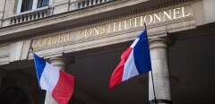 A photo taken on October 15, 2018 shows French flags outside the headquarters of the French Constitutional Council (Conseil Constitutionnel) in Paris.