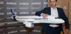 The president of Airbus Commercial Aircraft Business Guillaume Faury poses next to an Airbus plane model during the presentation of the annual results of the company in Blagnac, on February 14, 2019. - European aerospace giant Airbus said on February 14, 2019 it would end production of the A380 superjumbo, the double-decker jet which earned plaudits from passengers but failed to win over enough airlines to justify its massive costs. (Photo by REMY GABALDA / AFP)