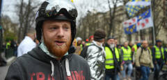 Maxime Nicolle aka Fly Rider, one of the leading figures of the "yellow vests" (gilets jaunes), looks on as he takes part in an anti-government demonstration in Paris on March 2, 2019. - "Yellow Vest" protesters take to the streets for the 16th consecutive Saturday. (Photo by ERIC FEFERBERG / AFP)