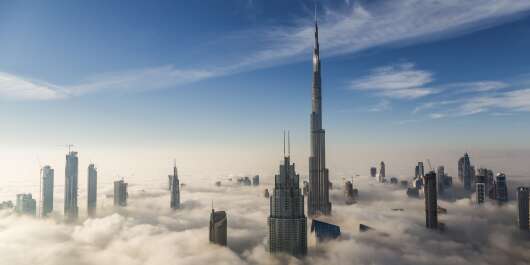 PIC BY Rustam Azmi / CATERS NEWS (PICTURED FOG IN DUBAI PIC TAKEN 04/01/18 ) - These skyscrapers poking out above the clouds give a whole new meaning to the city skylines. The incredible images of giant buildings soaring above Dubais thick fog make it appear as if penthouse residents and workers are living in their own dreamland. At sunrise, the golden glow cast by the suns rays turns the clouds the colour of sand, as though the giant sand dunes have swept through the city. And at night the street and car lights way below can only dimly penetrate the fog to reach the people above. SEE CATERS COPY  - Rustam Azmi / CATERS NEWS//CATERSNEWSAGENCY_caters01511/Credit:CATERS/SIPA/1801151200