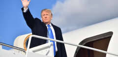 US President Donald Trump waves as he prepares to board Air Force One at Andrews Air Force Base in Maryland on October 13, 2018, en route to Lexington, Kentucky, for a "Make America Great Again" rally in Richmond. (Photo by Nicholas Kamm / AFP)