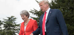 US President Donald Trump (R) and Britain's Prime Minister Theresa May (L) approach the lecturns for a joint press conference following their meeting at Chequers, the prime minister's country residence, near Ellesborough, northwest of London on July 13, 2018 on the second day of Trump's UK visit. - US President Donald Trump launched an extraordinary attack on Prime Minister Theresa May's Brexit strategy, plunging the transatlantic "special relationship" to a new low as they prepared to meet Friday on the second day of his tumultuous trip to Britain. (Photo by Stefan Rousseau / POOL / AFP)