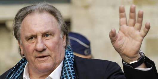 French actor Gerard Depardieu waves as he arrives at the Town Hall  in Brussels for a ceremony as part of the 'Brussels International Film Festival' (Briff) on June 25, 2018. (Photo by THIERRY ROGE / BELGA / AFP) / Belgium OUT